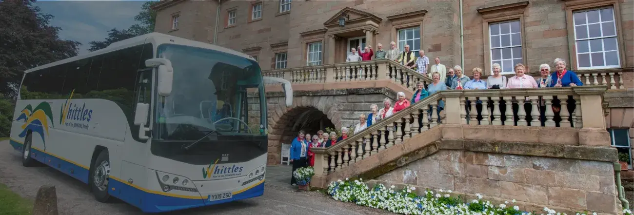 Whittles coach at stately home with people
