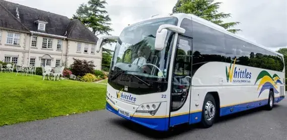 Whittles coach outside hotel